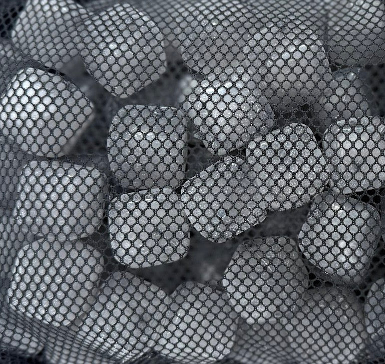 Close-up of purified-water reusable ice cubes contained inside a NUGSAX mesh bag